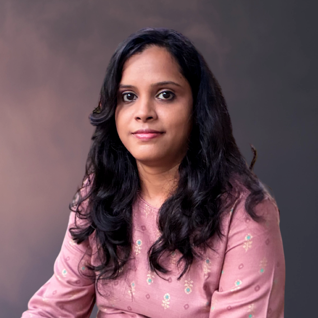 Portrait of a professional woman with long hair wearing a traditional outfit, representing leadership, confidence, and purpose-driven entrepreneurship